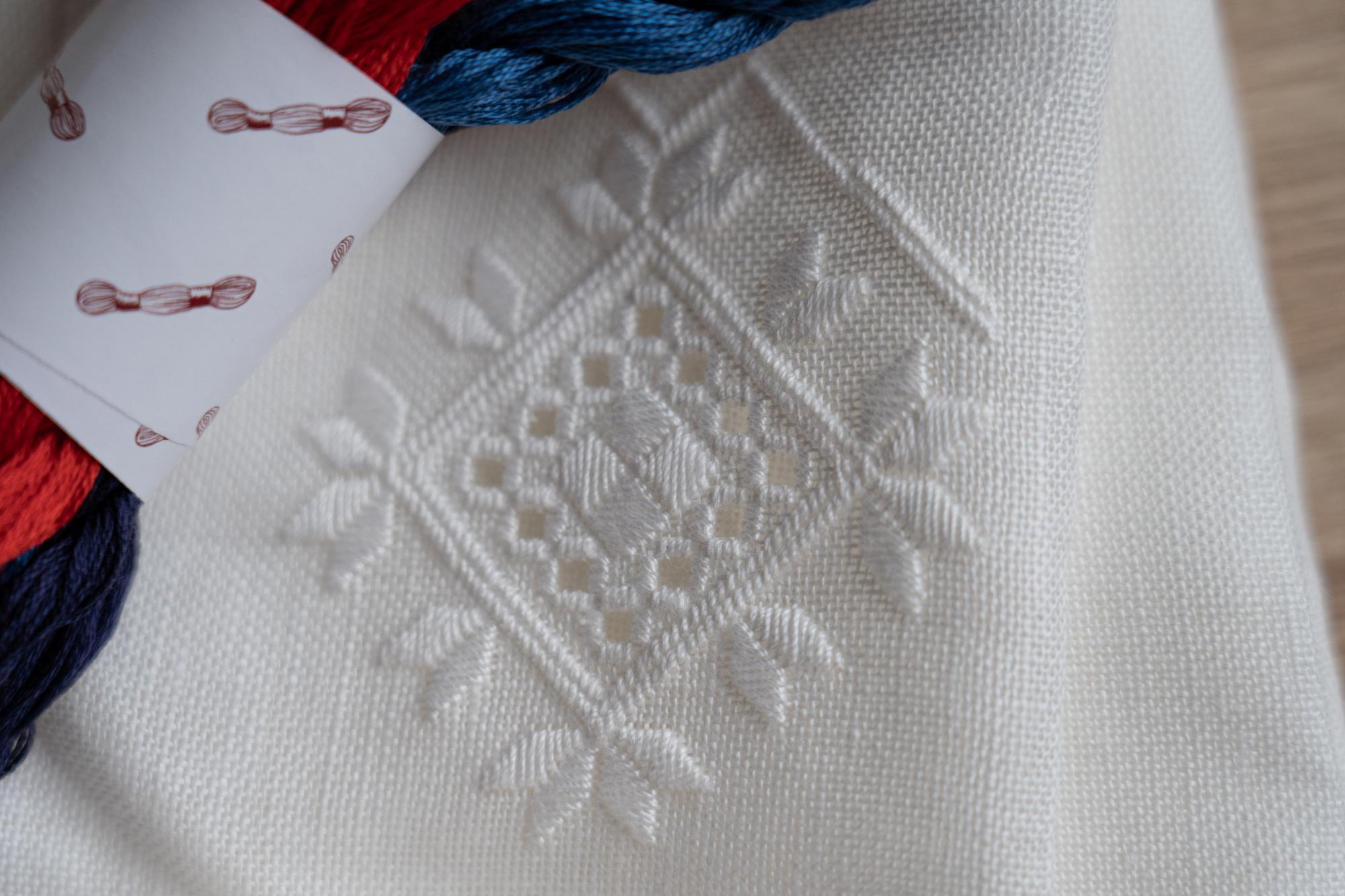 Embroidered fabric after restoration with detailed stitches